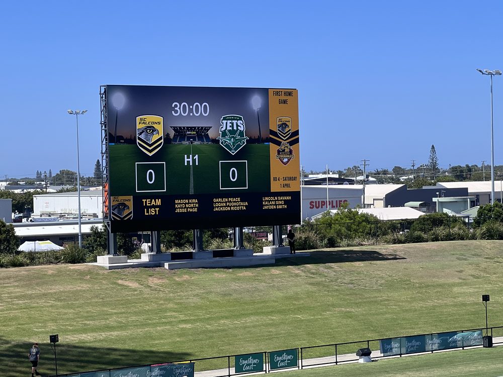 LED scoreboard structure at a sports field during a match
